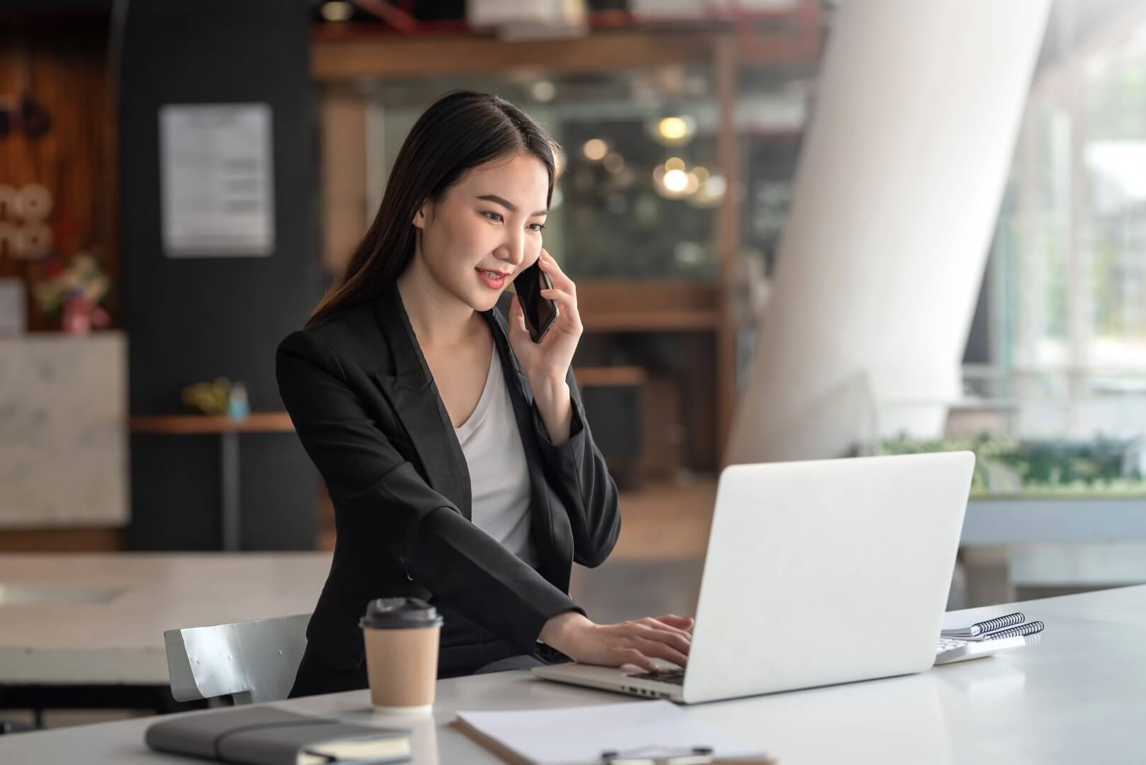 businesswoman talk phone with customers