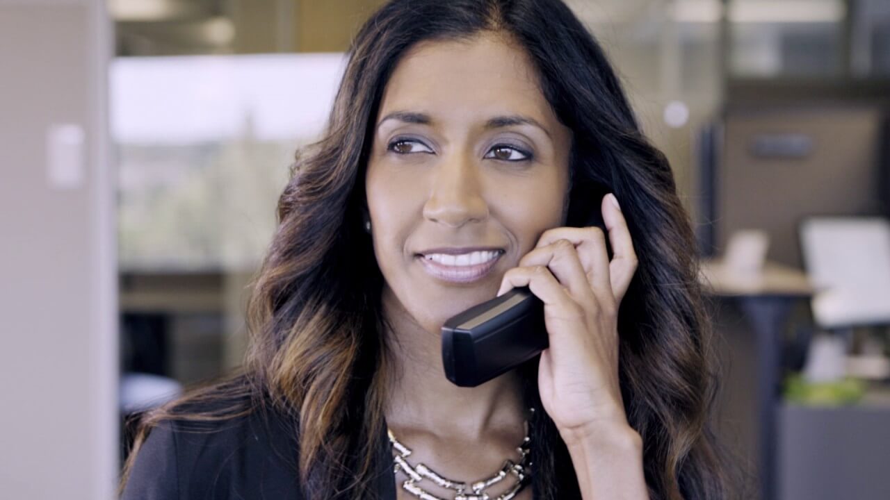 women talking on the mitel phone